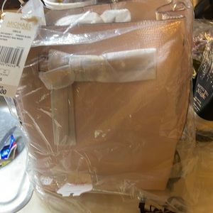 Pink Michael Kors bag still in package with tag never used